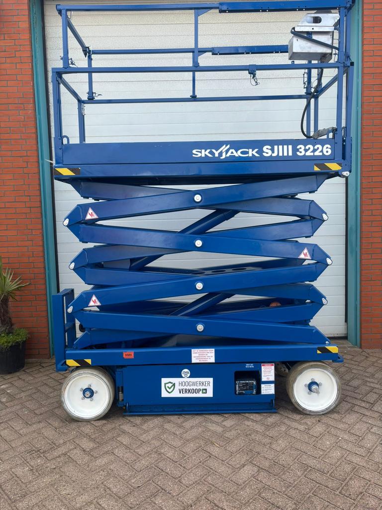 Sky jack 3226schaarhoogwerker nieuwe keuring 10 m, Ophalen of Verzenden