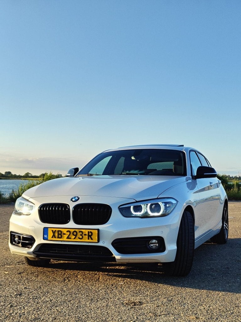 BMW 1-Serie 118i 136pk Aut 2018 Wit, Auto's, BMW, Stoelverwarming, Wit, 650 kg, Particulier