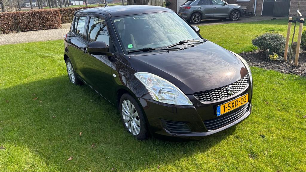 Suzuki Swift 1.2 5-D 2013 Bruin Airco/cruise/stoelverw., Auto's, Voorwielaandrijving, 4 cilinders, Bruin, 400 kg