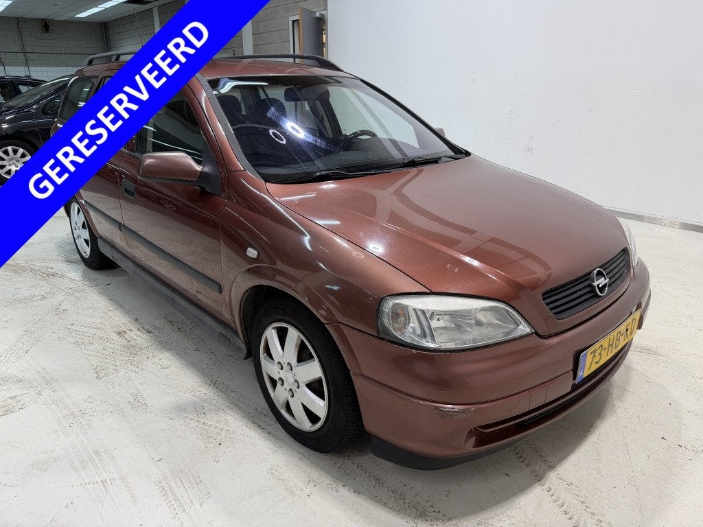 Opel Astra Wagon 1.6-16V Comfort, Auto's, Verwarmde buitenspiegels, 1598 cc, Rood, 5 stoelen