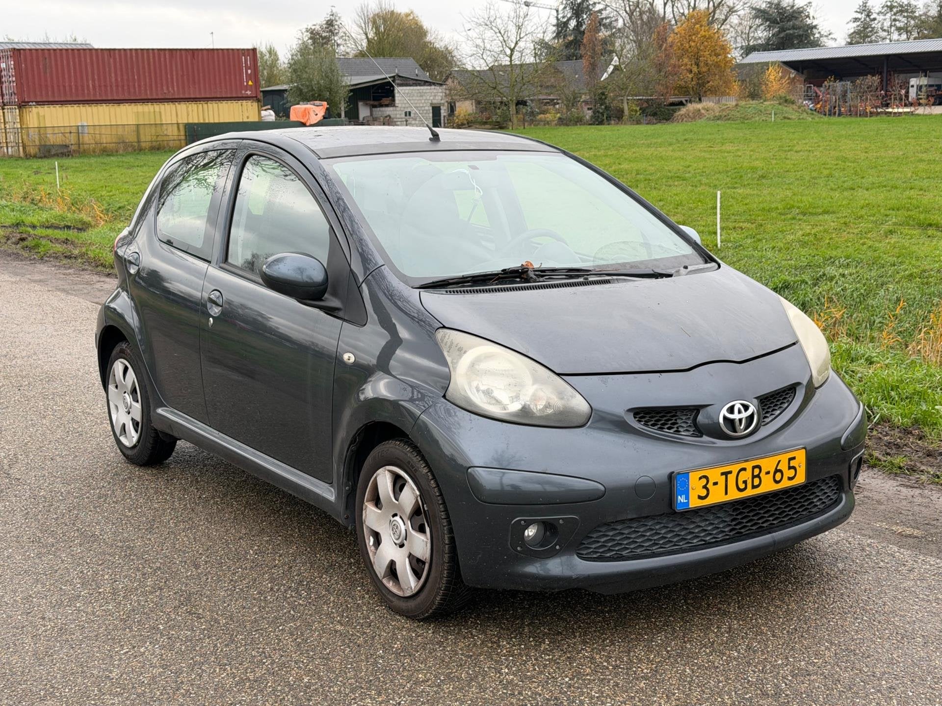 Toyota Aygo 1.0-12V LEES TEKST! GEEN APK Airco 5Drs NAP, Voorwielaandrijving, Stof, Gebruikt, Zwart