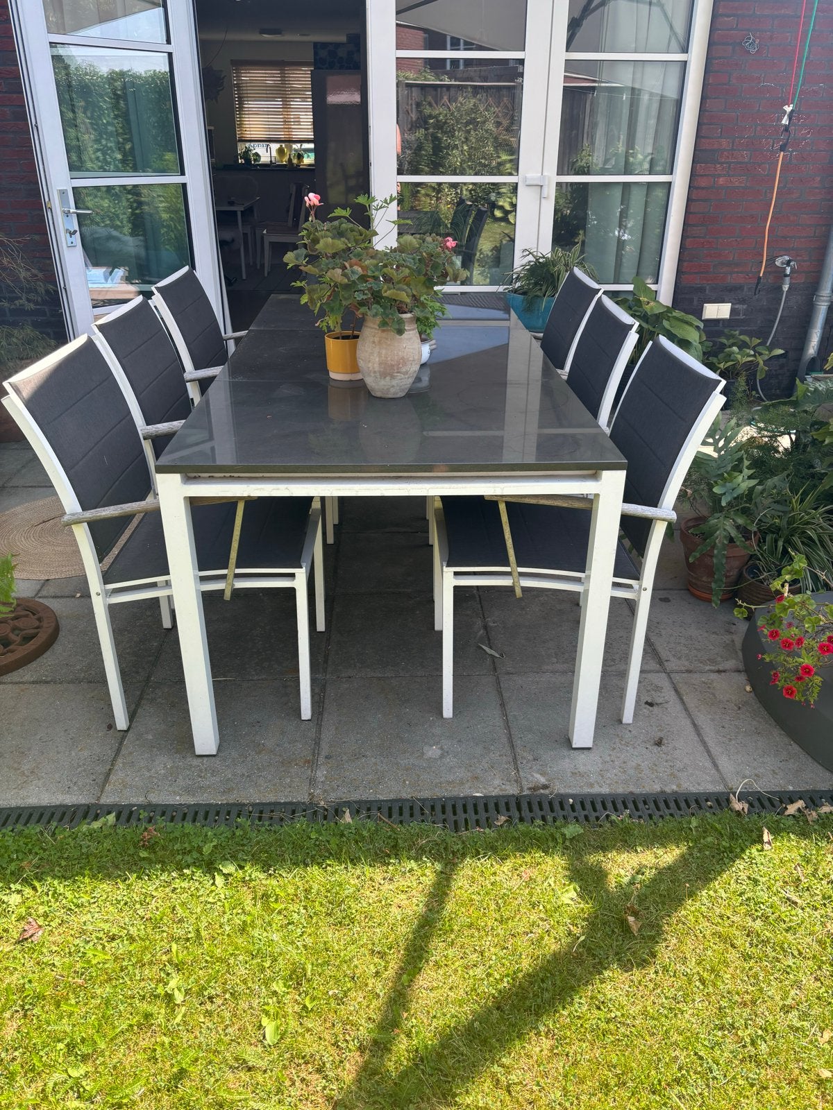 Moderne tuinset met 6 stoelen en natuursteen tafelblad zwart, Ophalen, Gebruikt, Eettafel, 6 zitplaatsen
