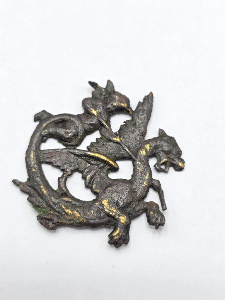 Bodemvondst Insigne Cupido & Draak
Brons, Verzenden