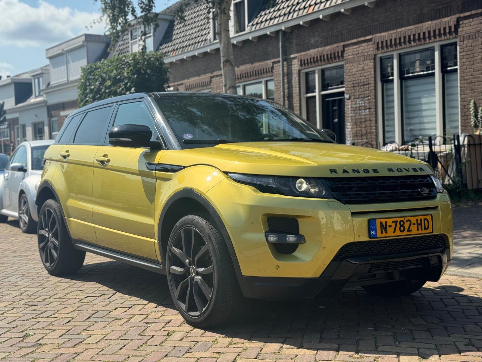 Land Rover Range Rover Evoque SICILIAN YELLOW  SI4 4WD AUT, Auto's, Automaat, 1800 kg, Vierwielaandrijving, Particulier