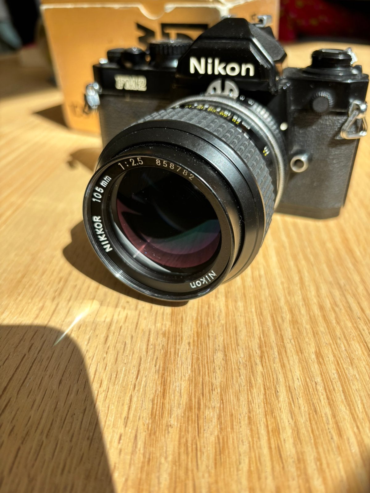 Nikon FM2N met 105mm f2.5 Ai-s, Audio, Tv en Foto, Fotocamera's Analoog, Ophalen of Verzenden, Zo goed als nieuw, Spiegelreflex
