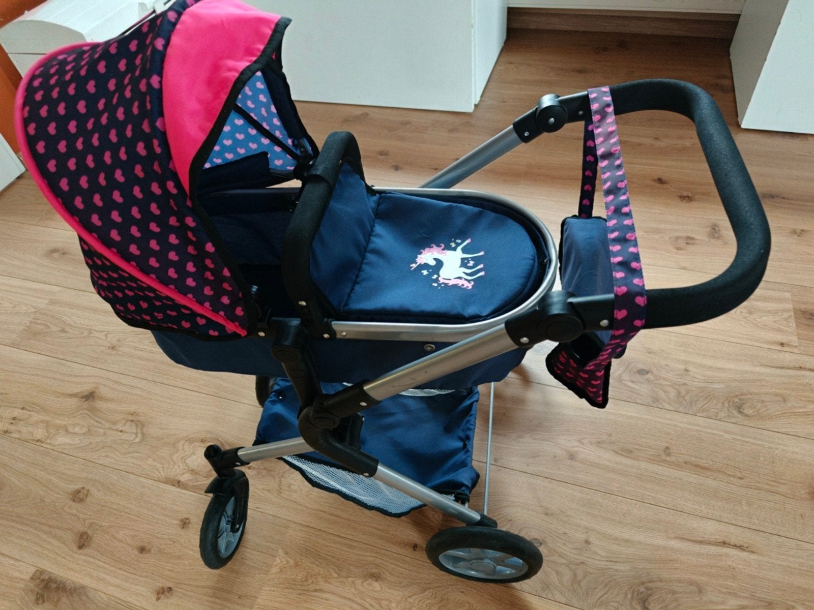 Poppen wandelwagen met lig- en zitstand, Ophalen
