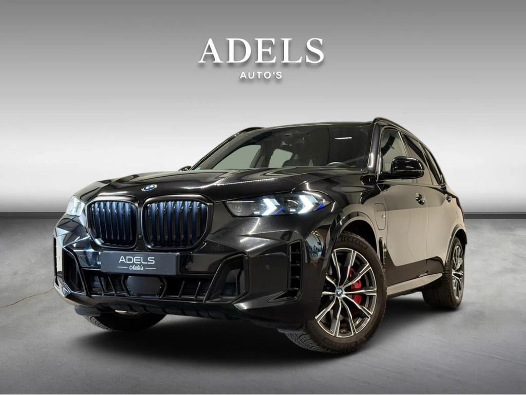 BMW X5 xDrive50e M Sport Pro Trekhaak HUD Iconicglow Shadowl, Automaat, Gebruikt, 2395 kg, Verwarming stoelen achter