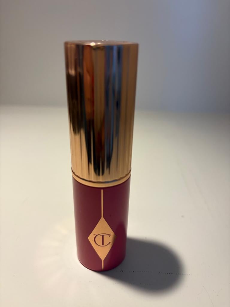 Charlotte Tilbury unreal blush stick - rosy glow, Ophalen of Verzenden, Zo goed als nieuw, Roze, Wangen