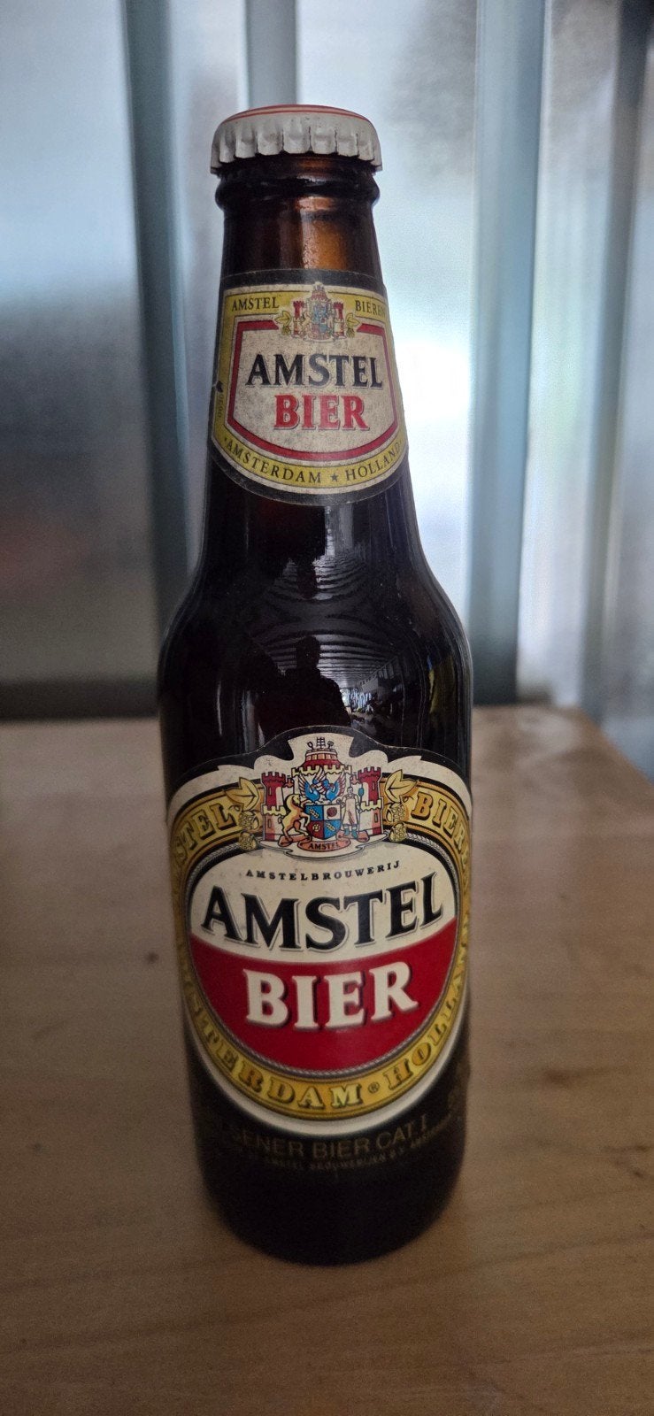 Amstel bierflesje uit 1992 met zeldzame Heineken dop, Ophalen of Verzenden, Gebruikt