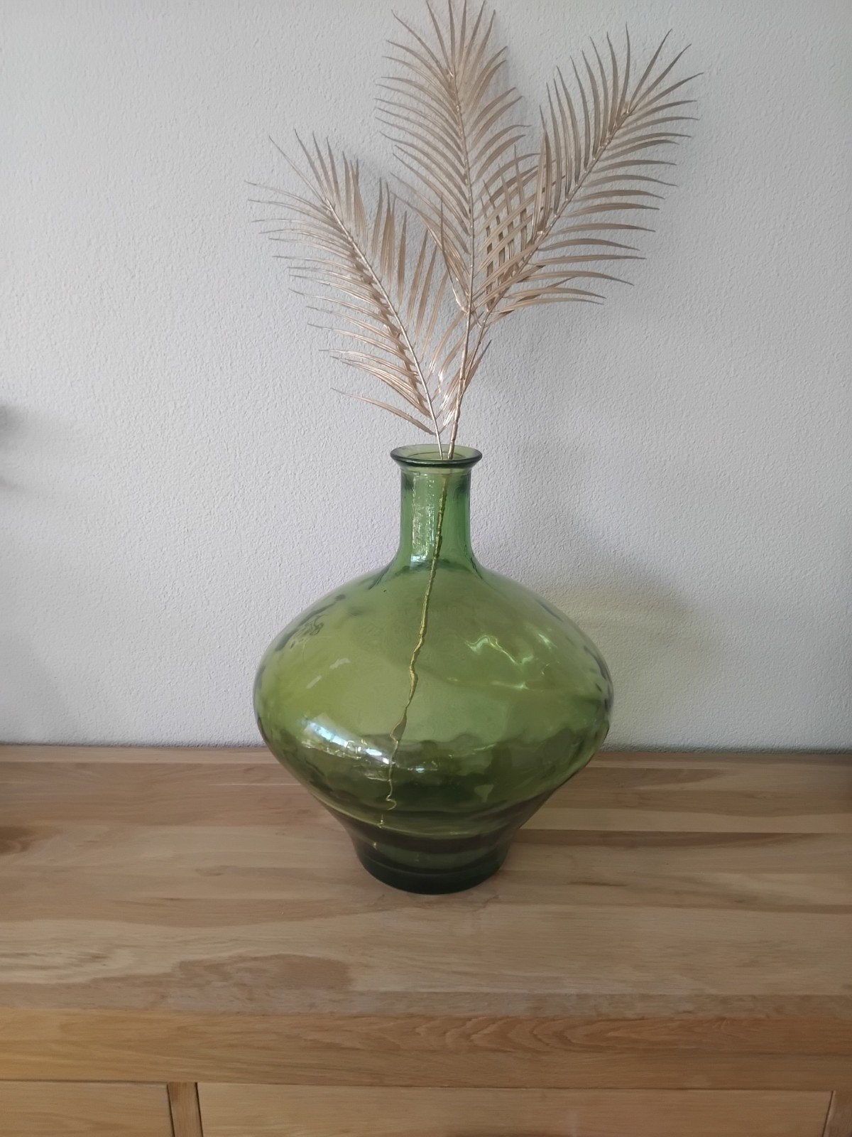 Grote groene glazen vaas, Ophalen