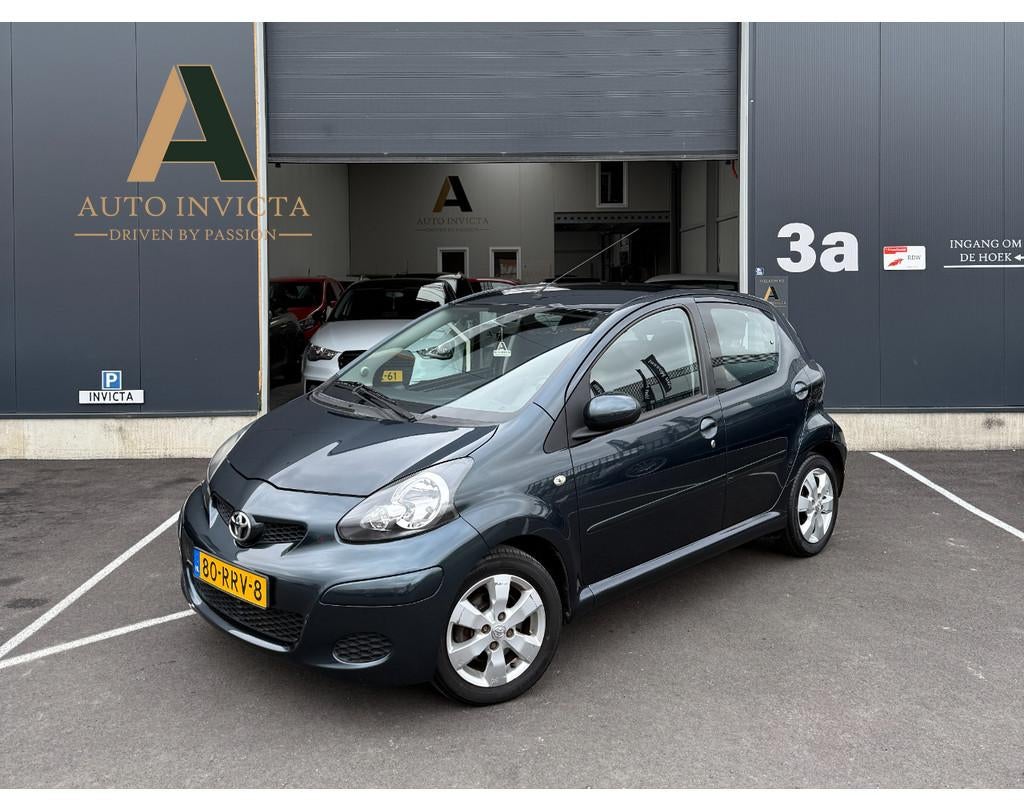 Toyota Aygo 1.0-12V Aspiration Green Navigator (bj 2011), Auto's, Voorwielaandrijving, Gebruikt, 4 stoelen, 68 pk
