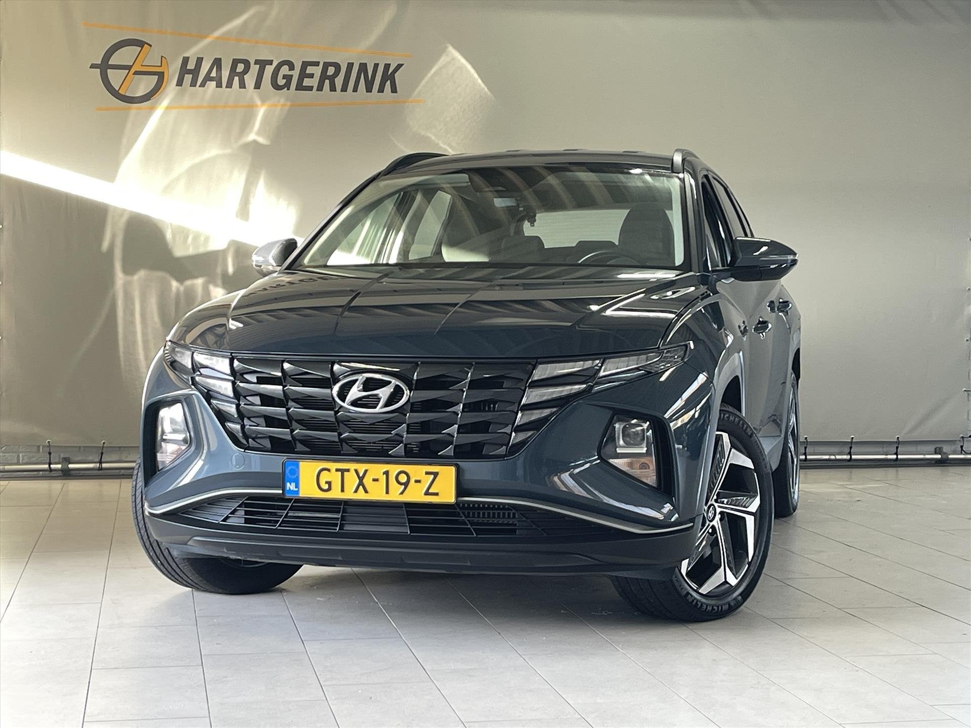 Hyundai Tucson 1.6 T-GDi PHEV AWD Aut Comfort* Navi / Camera, Auto's, Automaat, Stof, 4 cilinders, Blauw