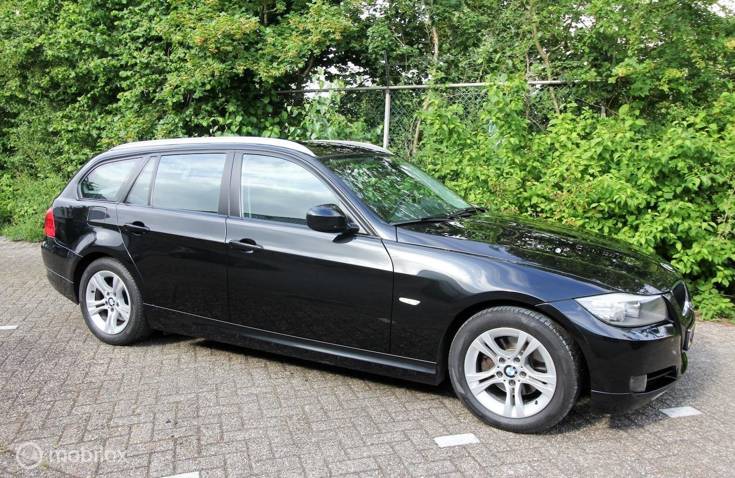 BMW 3-serie Touring 318i E91 LCI Leer Navi Xenon Voll.Hist., Euro 5, 4 cilinders, Zwart, Handgeschakeld