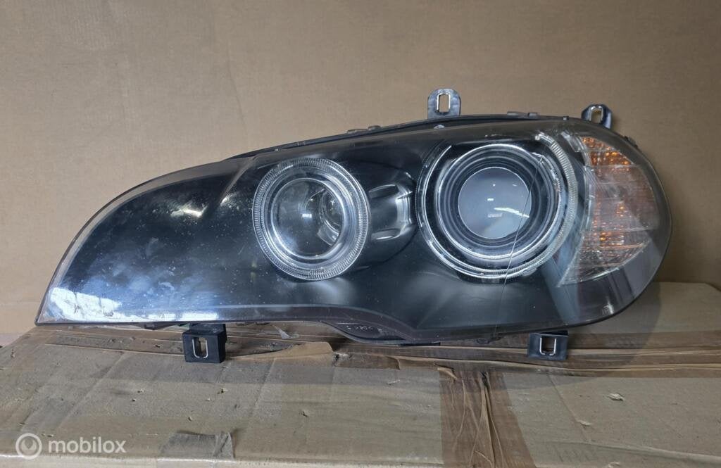Bmw x5 Koplamp links E70 Bi xenon 63117288995, Gebruikt, Ophalen of Verzenden