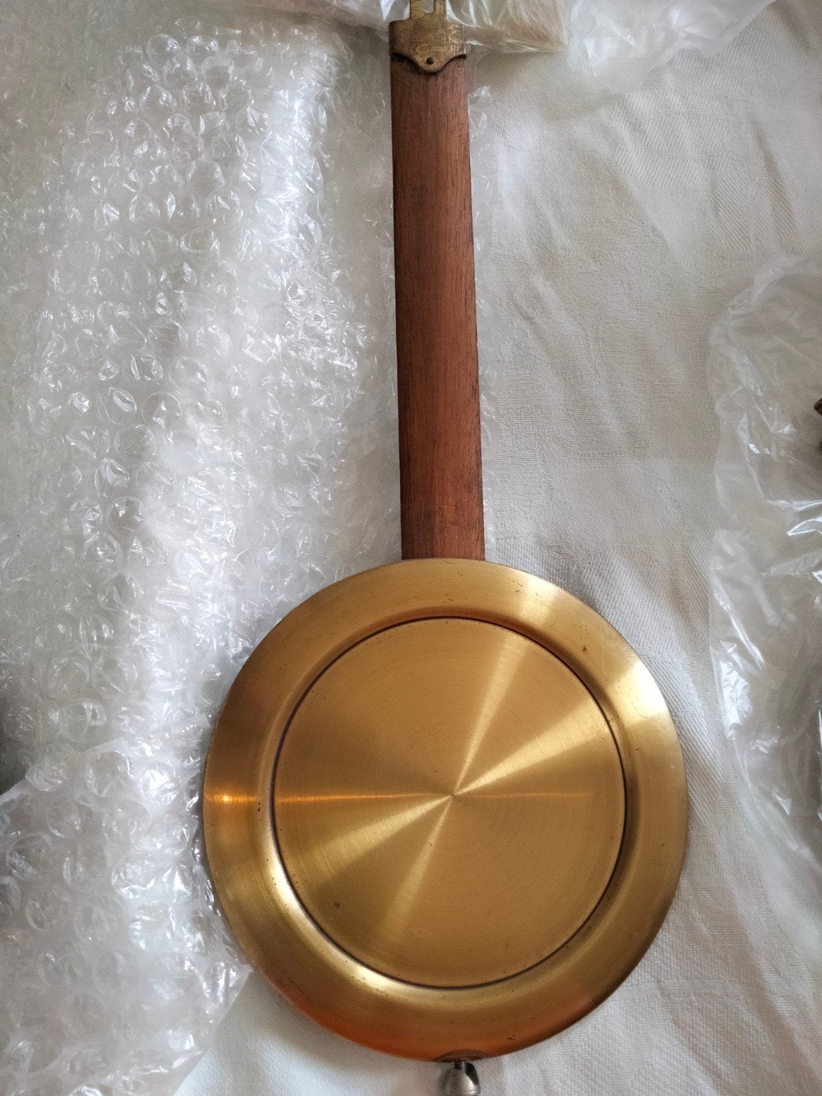 Klokkenslinger (31cm) met houten staaf en messing lens, Ophalen