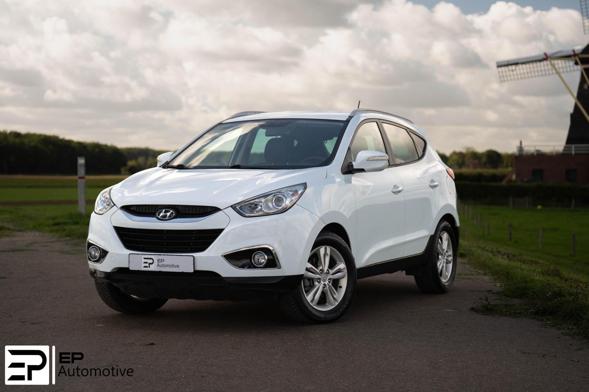 Hyundai ix35 2.0i|Trekhaak|Camera|CruiseControl|HalfLeder|, Auto's, Gebruikt, Zwart, 4 cilinders, 2000 kg