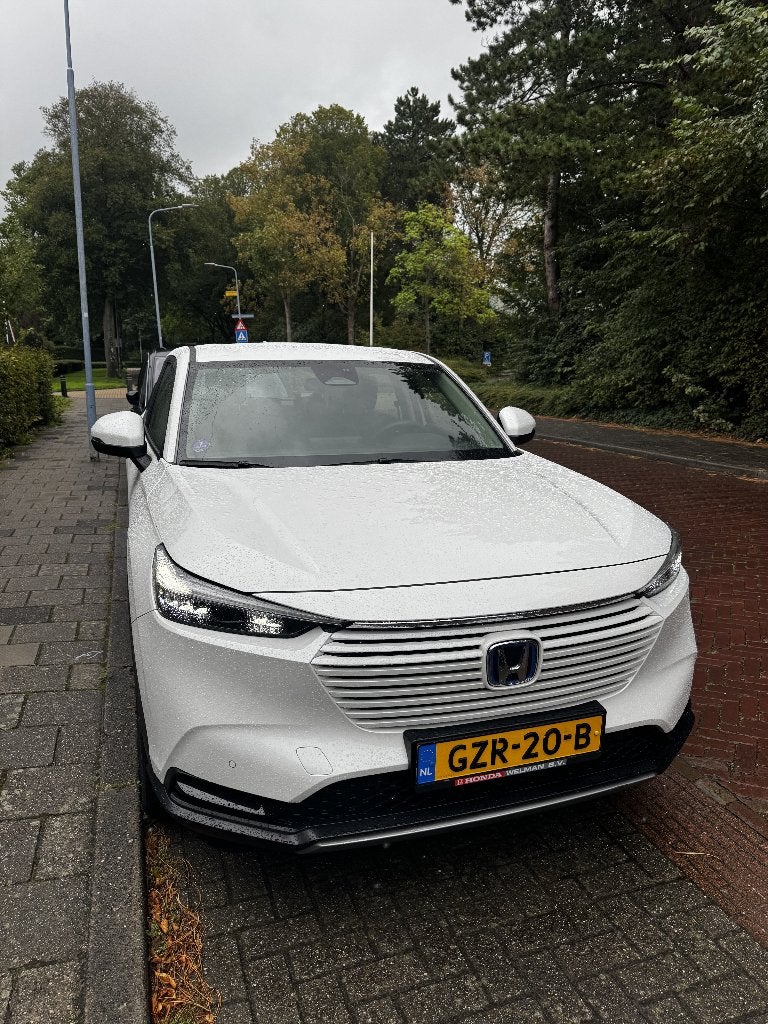 Honda HR-V 1.5 e:HEV Elegance 2025 Garantie 2032 | dealer o., Auto's, Dealer onderhouden, 1498 cc, Leder en Stof, Wit