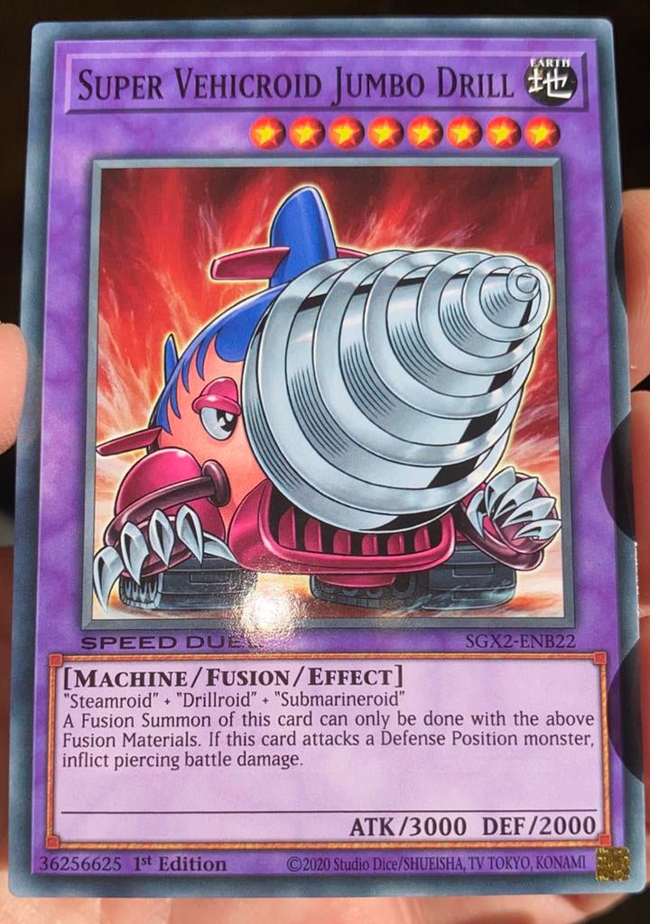Yu-Gi-Oh! Super Vehicroid Jumbo Drill SGX2 1st Edition !, Ophalen of Verzenden, Zo goed als nieuw, Losse kaart