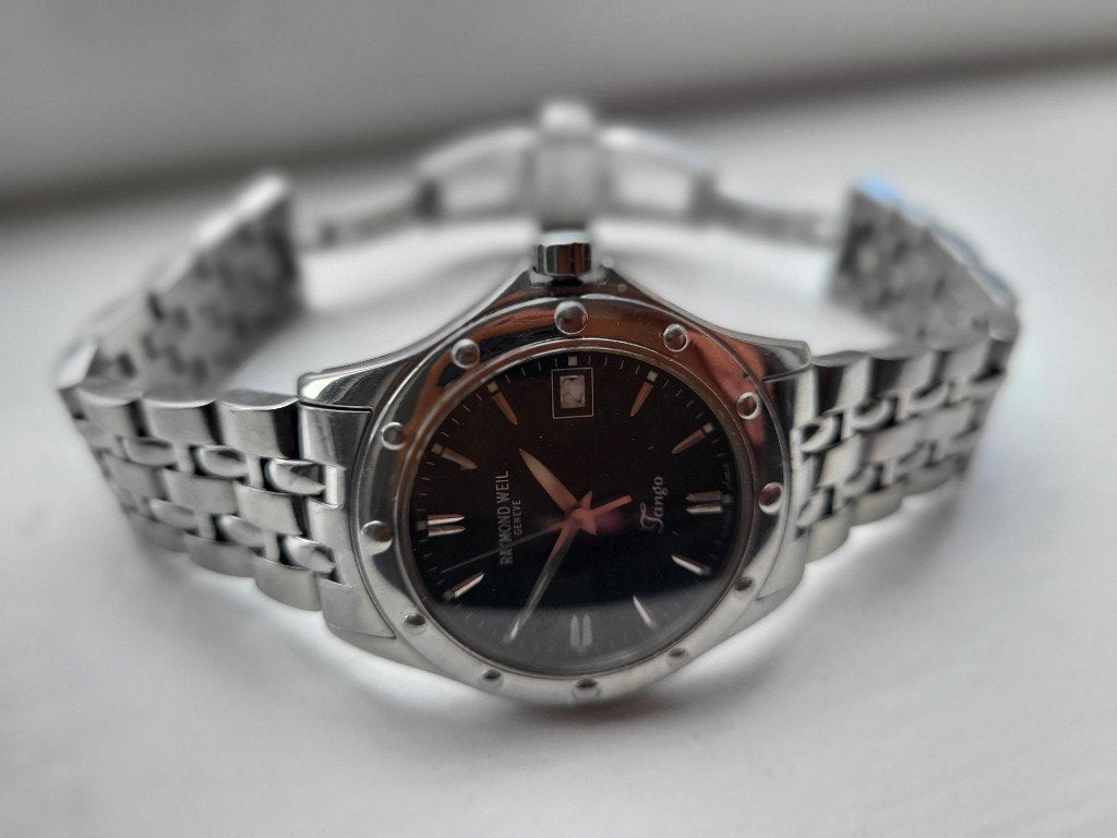 Raymond Weil horloge TANGO zwarte plaat perfecte staat, Sieraden, Tassen en Uiterlijk, Overige merken, Staal, Staal, Polshorloge