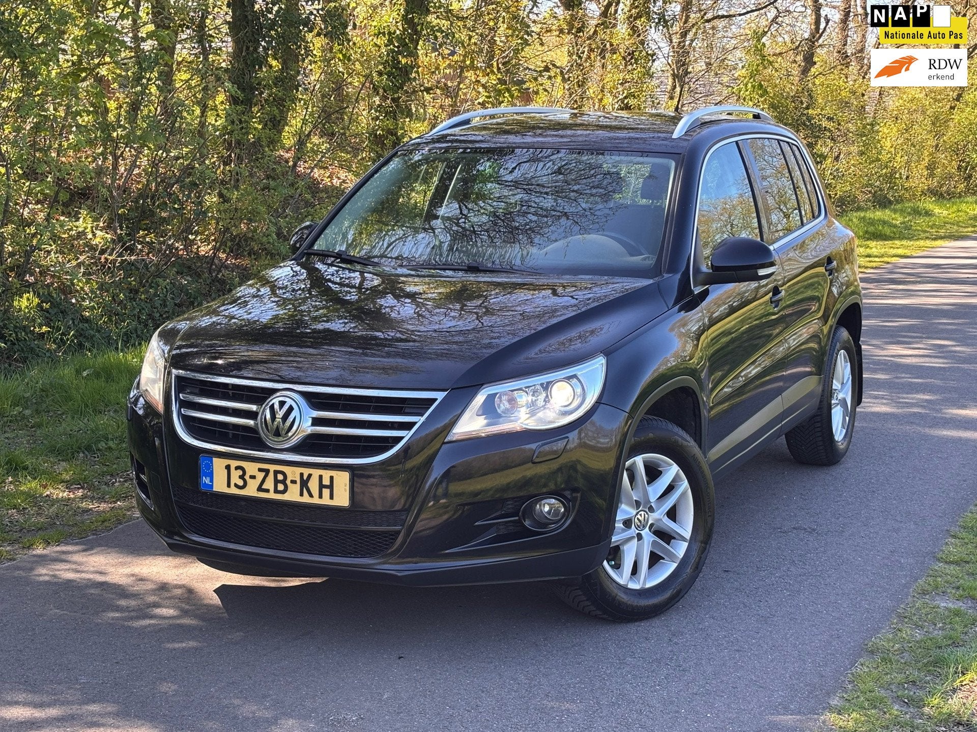 Volkswagen Tiguan 1.4 TSI Sport&Style 4Motion | Cruise + Cli, Gebruikt, 4 cilinders, Zwart, Origineel Nederlands