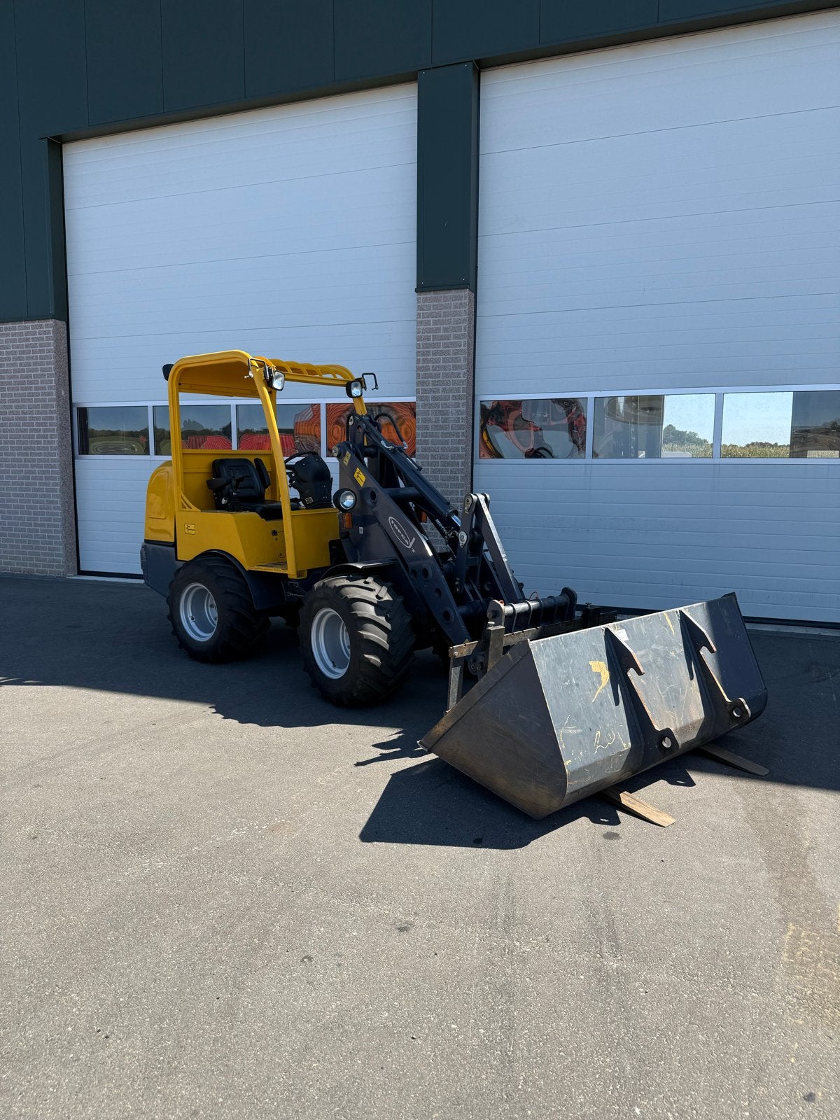 Compacte Topca loader met bak en lepels, Ophalen of Verzenden
