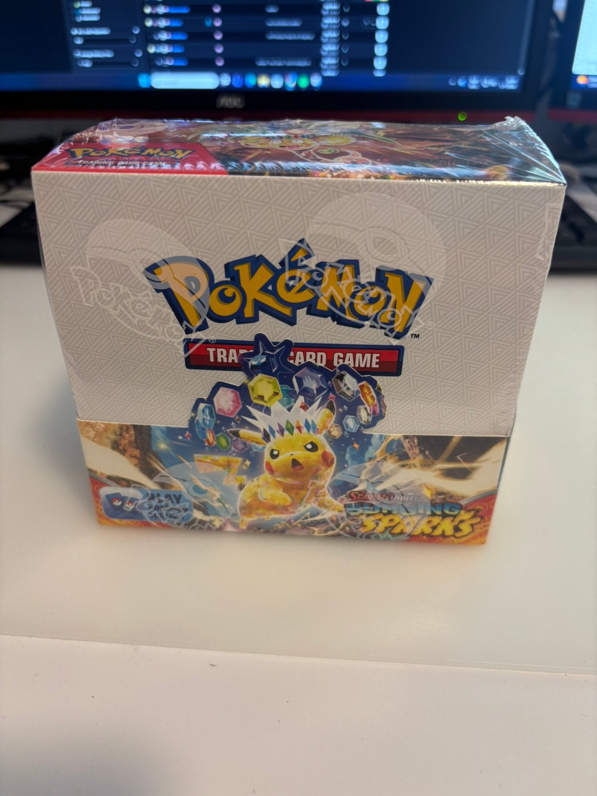 Surging Sparks Booster Box, Ophalen of Verzenden, Zo goed als nieuw