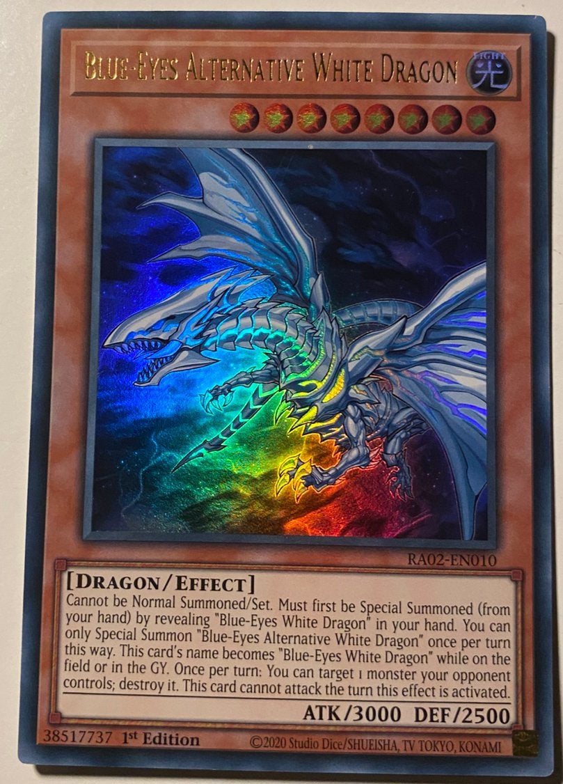 Yu-Gi-Oh! Blue-Eyes Alternative White Dragon RA02 1st !, Ophalen of Verzenden, Zo goed als nieuw, Losse kaart, Foil