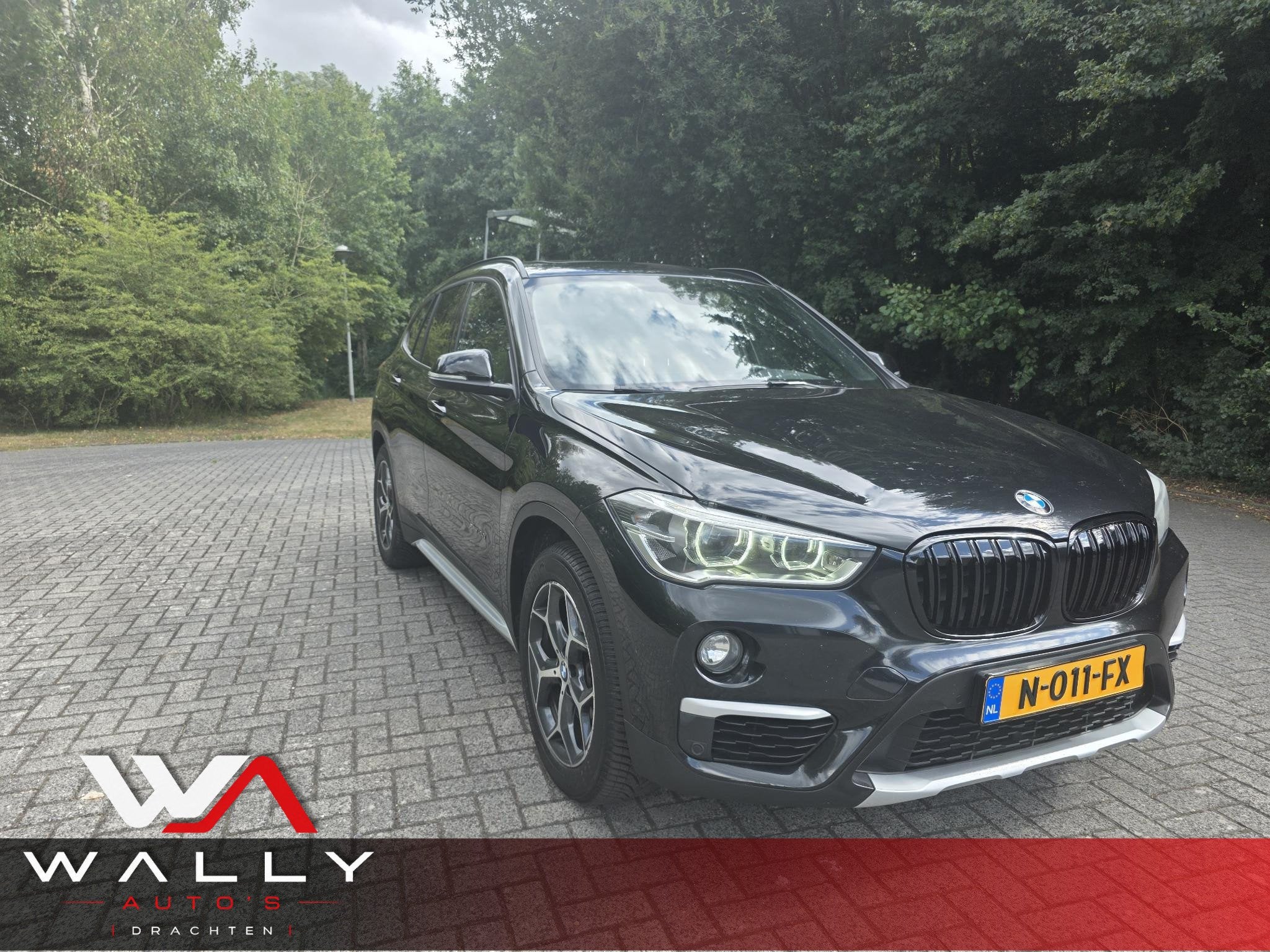 BMW X1 xDrive20i Centennial High Executive, Auto's, 1998 cc, Gebruikt, 2000 kg, Zwart