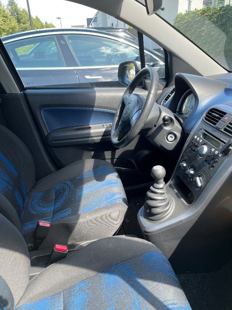 Opel Agila 1.0 12V 2013 Blauw, Auto's, Opel, Voorwielaandrijving, Euro 5, Stof, Blauw