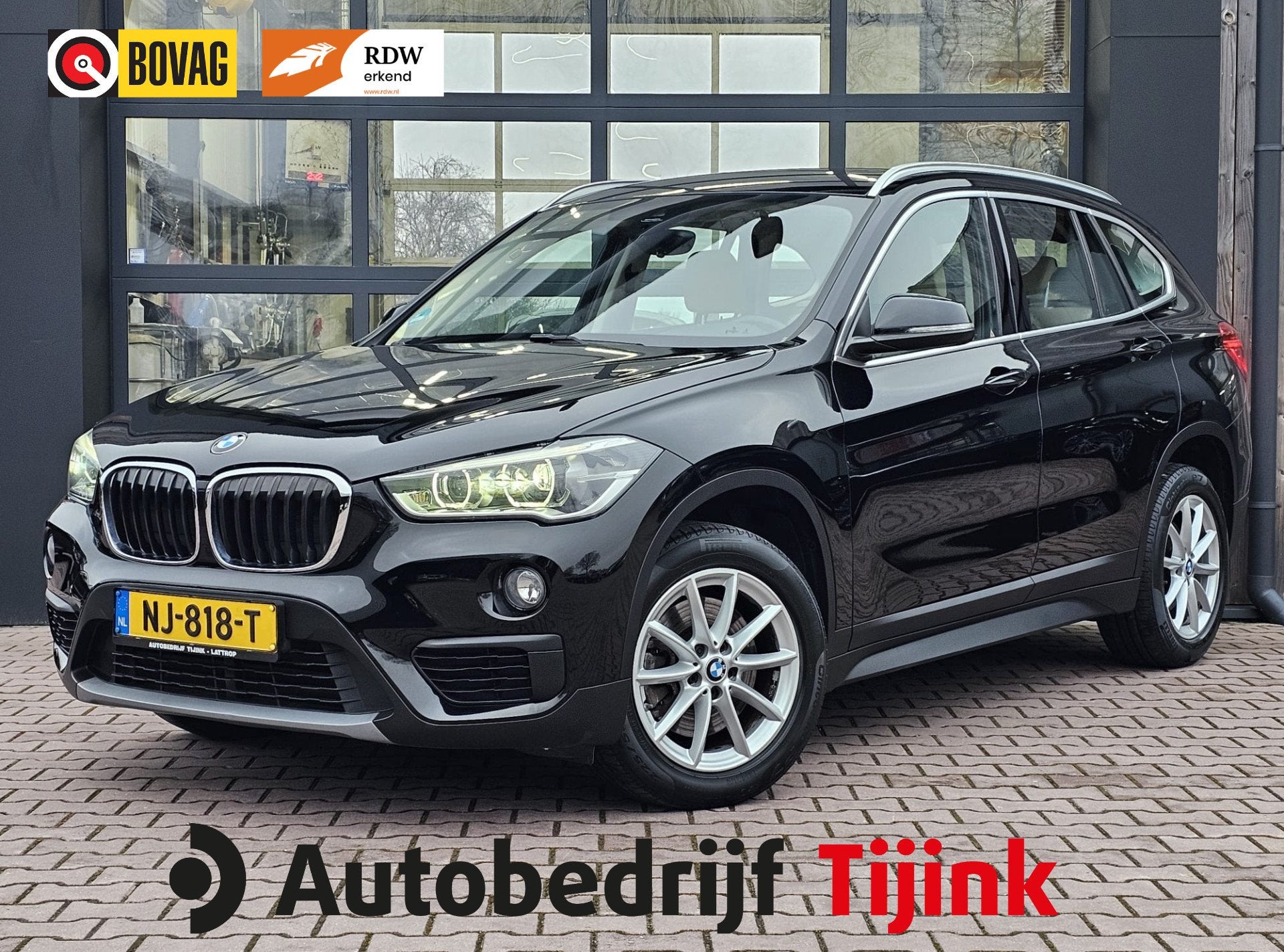 BMW X1 sDrive20i Centennial High Executive | Automaat | Navi, Auto's, BMW, 1998 cc, Euro 6, Met garantie (alle), Zwart
