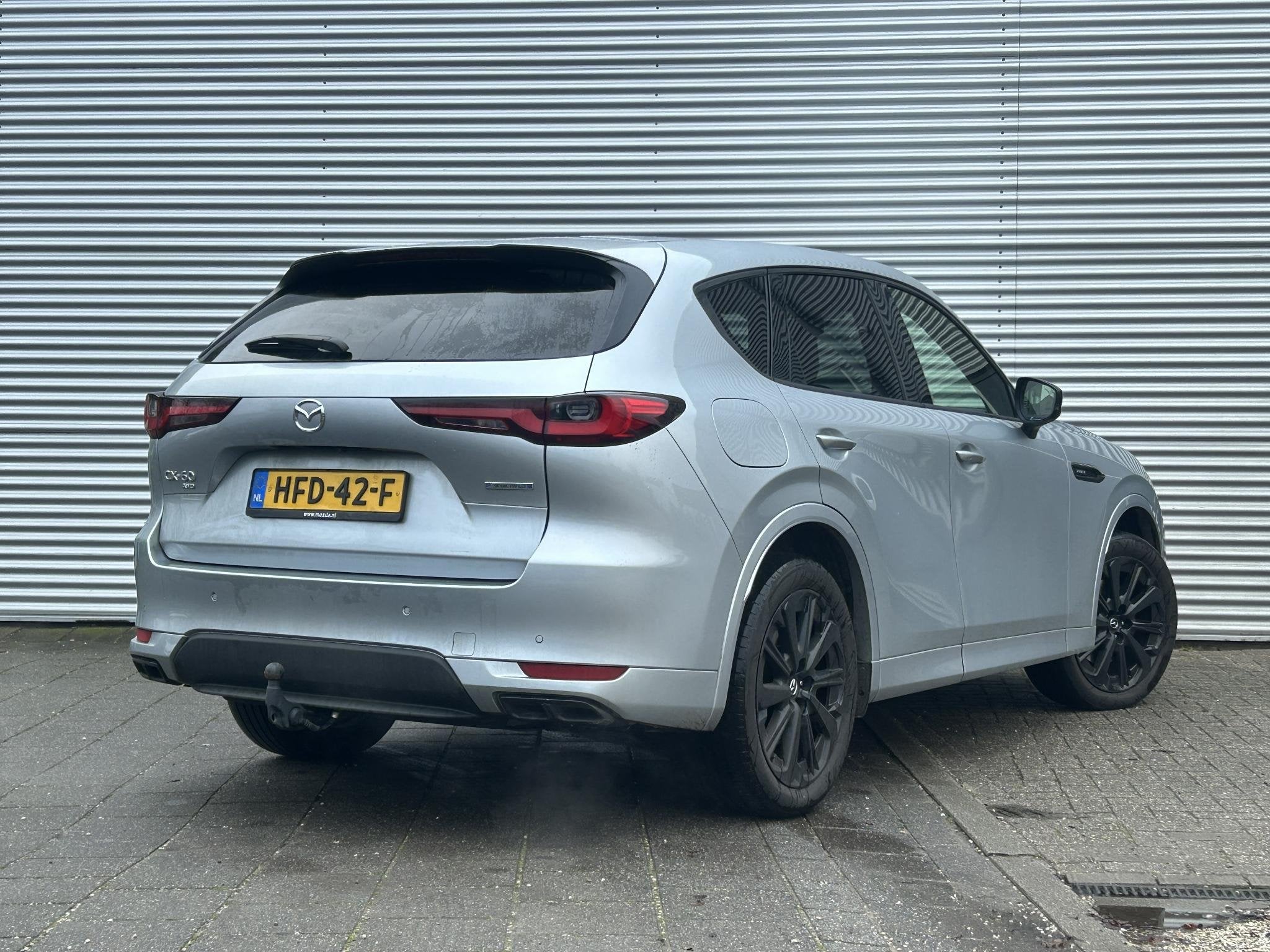Mazda CX-60 2.5 e-SkyActiv PHEV Homura Business Edition | Tr, Auto's, Lichtsensor, Gebruikt, 4 cilinders, 2500 kg