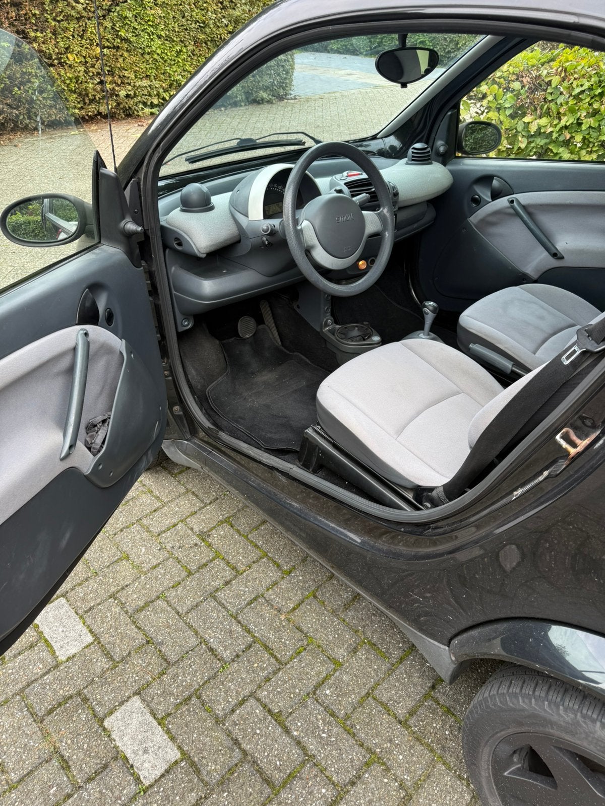 Smart 0.7 City Coupe 45KW 2004 Zwart semi automaat, Auto's, 21 km/l, Achterwielaandrijving, 18 €/maand, 61 pk