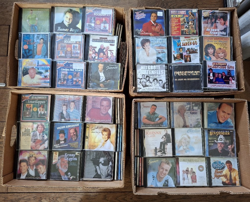 10 Bananendozen met Nederlandstalige en piratenhits CD's, Ophalen, Gebruikt, Levenslied of Smartlap