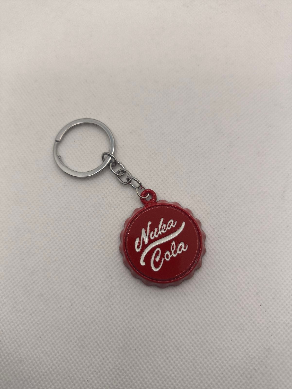 Leuke nuka cola Fallout flesopener sleutelhanger - nieuw, Ophalen of Verzenden, Zo goed als nieuw