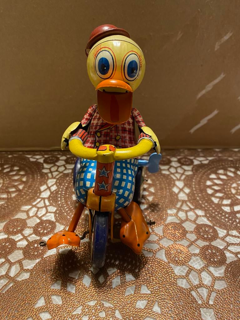 Blikken eend op fietsje uit Japan, Antiek en Kunst, Antiek | Speelgoed, Ophalen of Verzenden