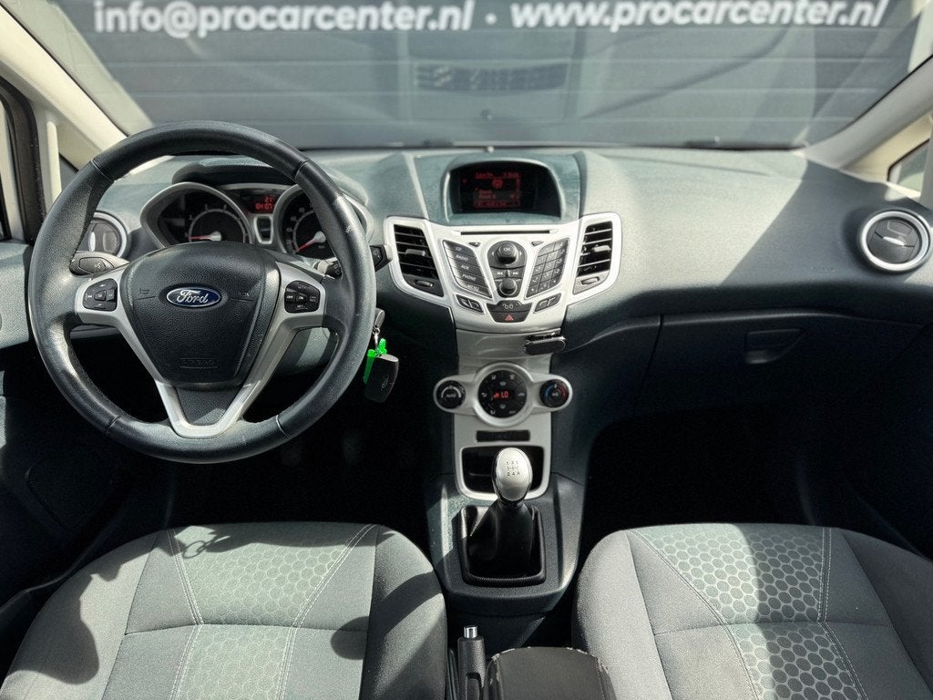 Ford Fiesta 1.25 Titanium CLIMATE|CRUISE|PDC|EL.RAMEN|LMV|NA, Auto's, Ford, Voorwielaandrijving, Euro 5, Stof, 1242 cc