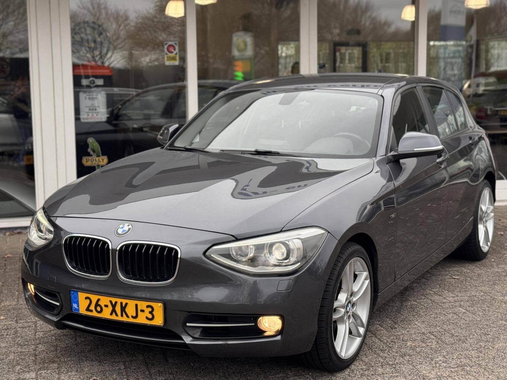 118i 170pk 6bak,Sport Line,Xenon,Sportstoelen,Clima,Navi,PDC, Auto's, 1-Serie, Euro 5, Gebruikt, Zwart