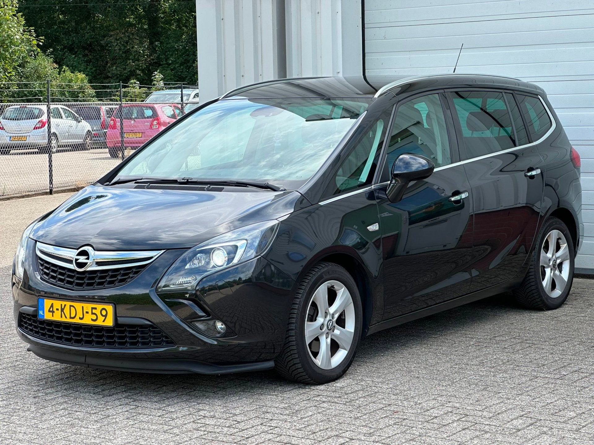 Opel Zafira Tourer 1.4 T Cosmo 7p. Cruise, Clima, Xenon, Hal, Auto's, Euro 5, Gebruikt, Zwart, 4 cilinders