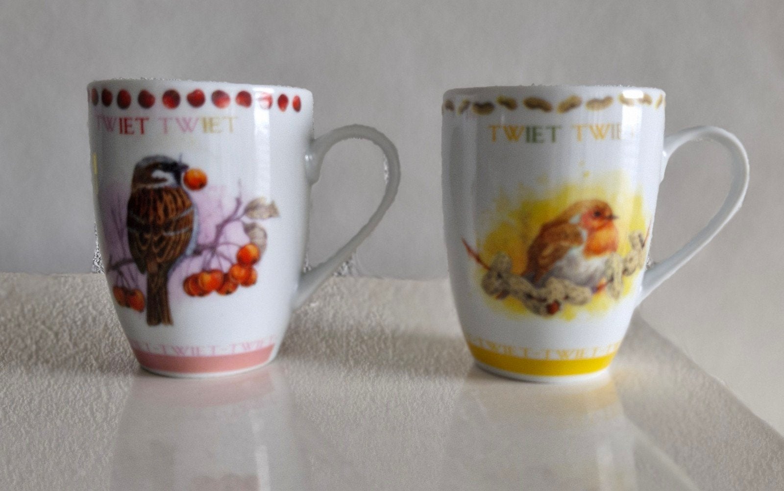 Twee Theo Bekers met Vogel opdrukken, Huis en Inrichting, Keuken | Servies, Verzenden, Zo goed als nieuw, Overige stijlen, Kop(pen) en/of Schotel(s)