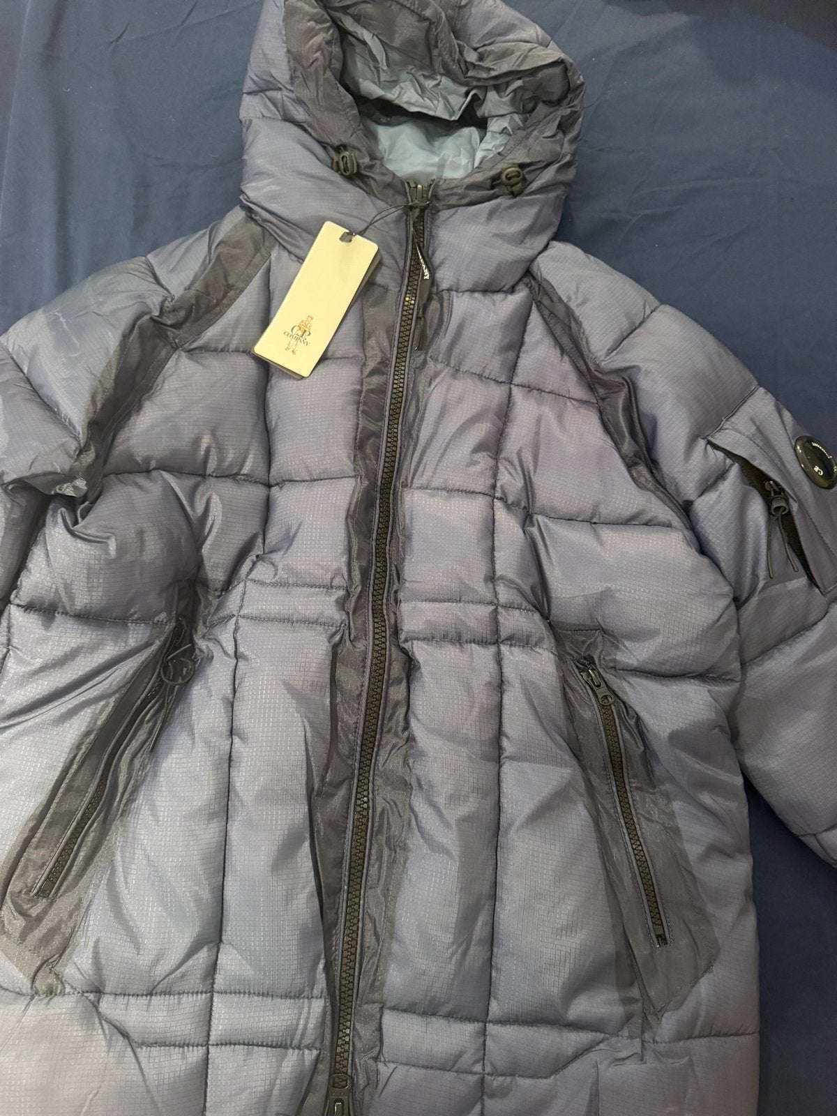 C.P. Company donsjack met capuchon - Maat M, Kleding | Heren, Ophalen of Verzenden, Nieuw, Maat 48/50 (M), Blauw