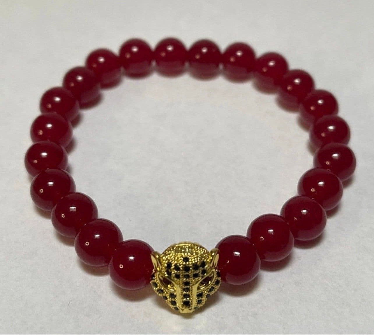 Set van Red Ruby en Lavasteen Armbanden met Panterhoofd, Overige materialen, Nieuw, Ophalen of Verzenden, Met bedels of kralen