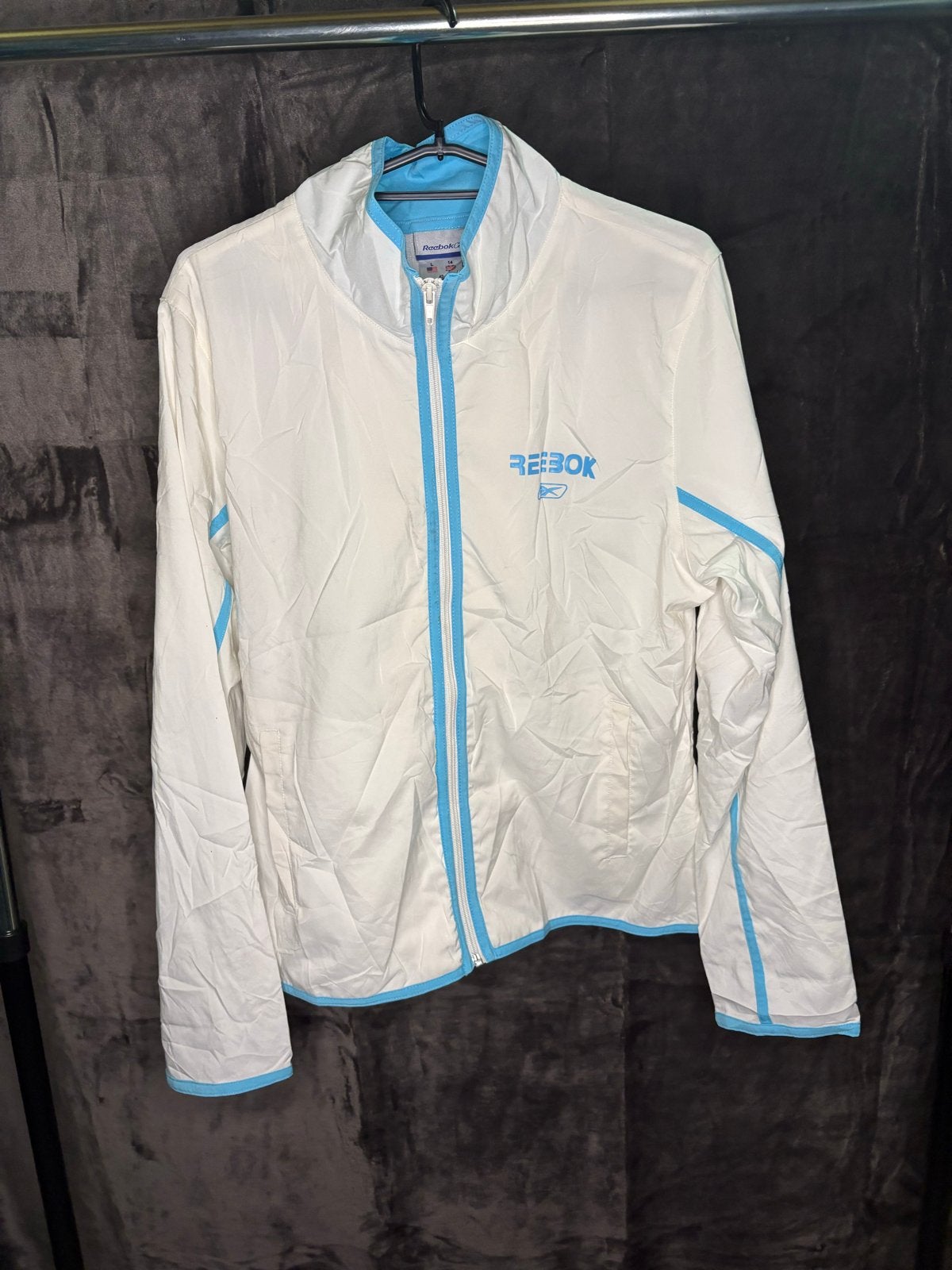 Vintage Reebok Windbreaker - Wit/Blauw, Verzenden, Gedragen, Maat 42/44 (L), Wit