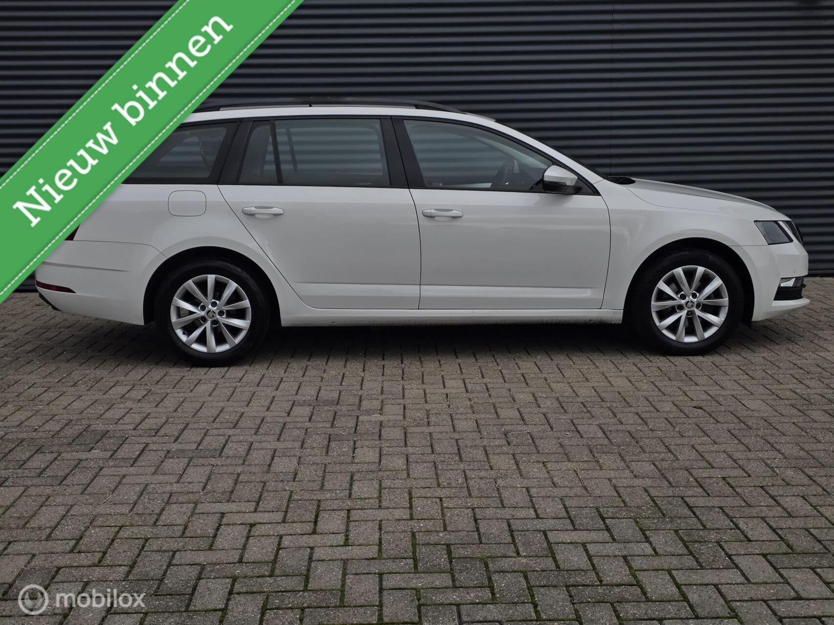 Skoda Octavia Combi 1.0 TSI Greentech Ambition Business, Auto's, Gebruikt, Euro 6, Met garantie (alle), Parkeersensor