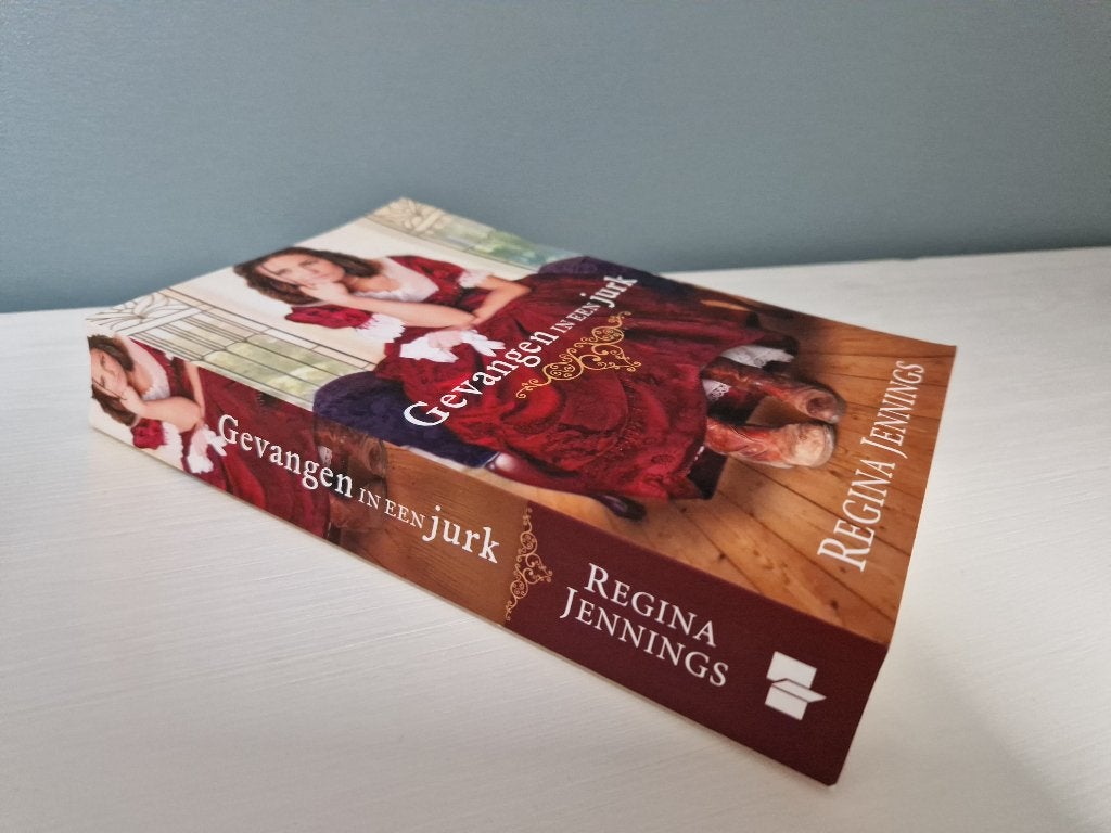 Christelijke roman, gevangen in een jurk, Regina Jennings, Boeken, Ophalen of Verzenden, Zo goed als nieuw