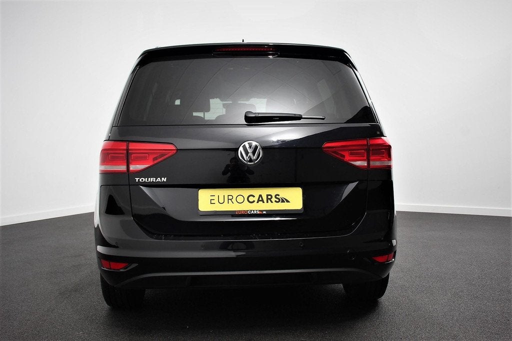 Volkswagen Touran 1.5 TSI 150pk DSG Comfortline 7p Navigatie, Auto's, Volkswagen, Stof, Zwart, 4 cilinders, 150 pk