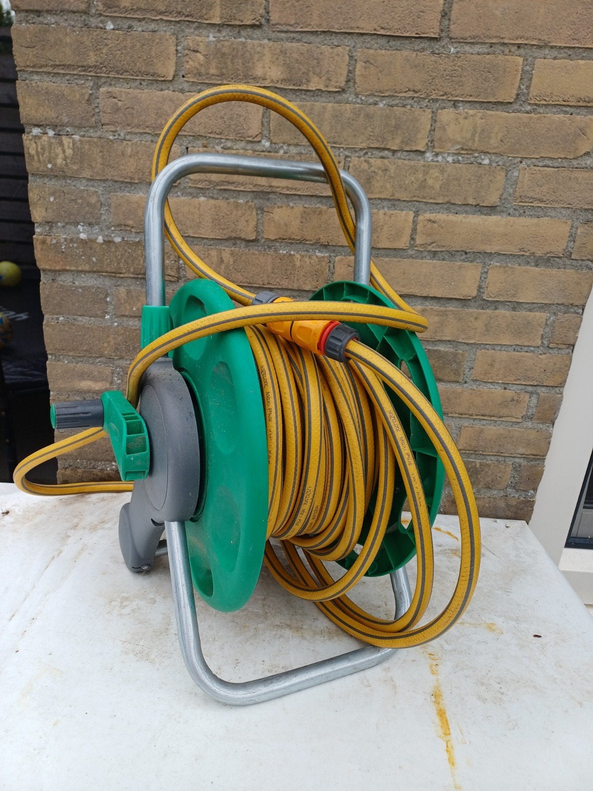 Hozelock slanghaspel en 25 meter slang, Ophalen, Zo goed als nieuw, Tuinslanghaspel