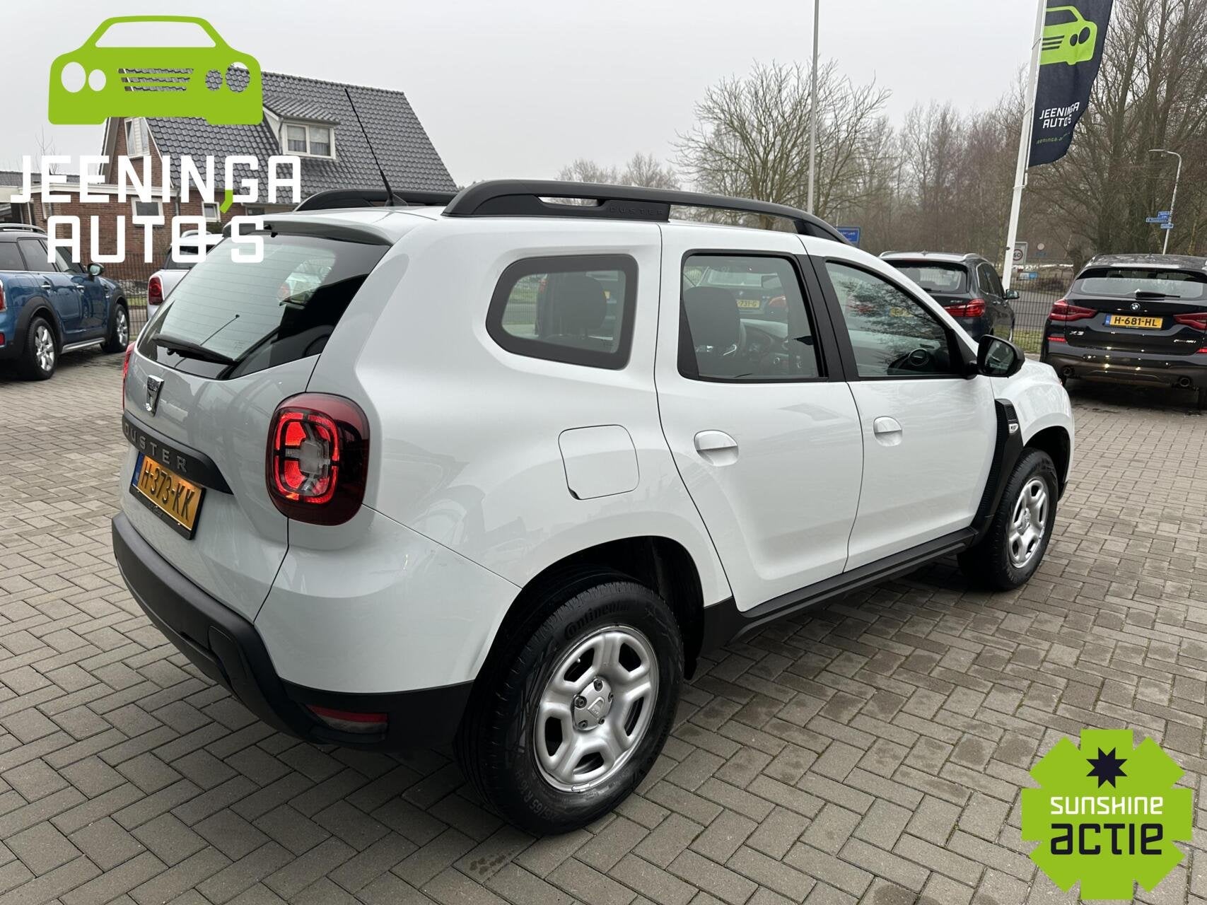 Dacia Duster TCe 100 Comfort|Airco|Cruise, Auto's, Gebruikt, 4 cilinders, Duster, Wit
