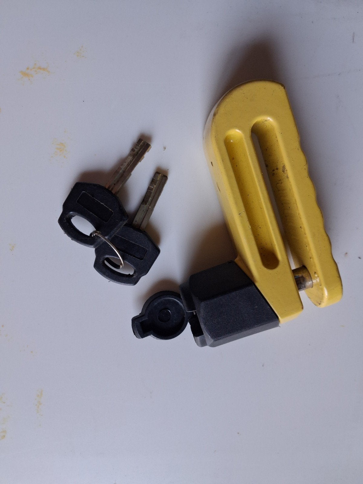 Schijfremslot met twee sleutels en afdekkap, Motoren, Ophalen
