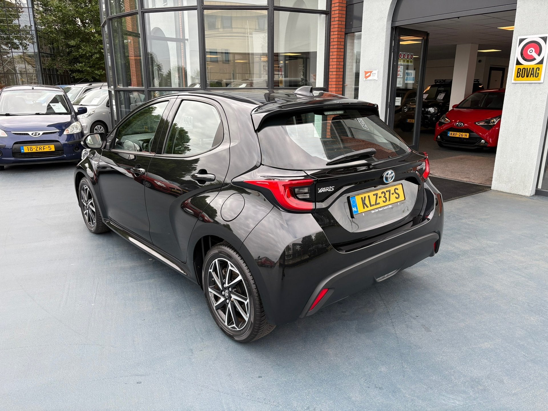 Toyota Yaris 1.5 Hybrid 115 Business, Auto's, Dealer onderhouden, 450 kg, Gebruikt, Euro 6