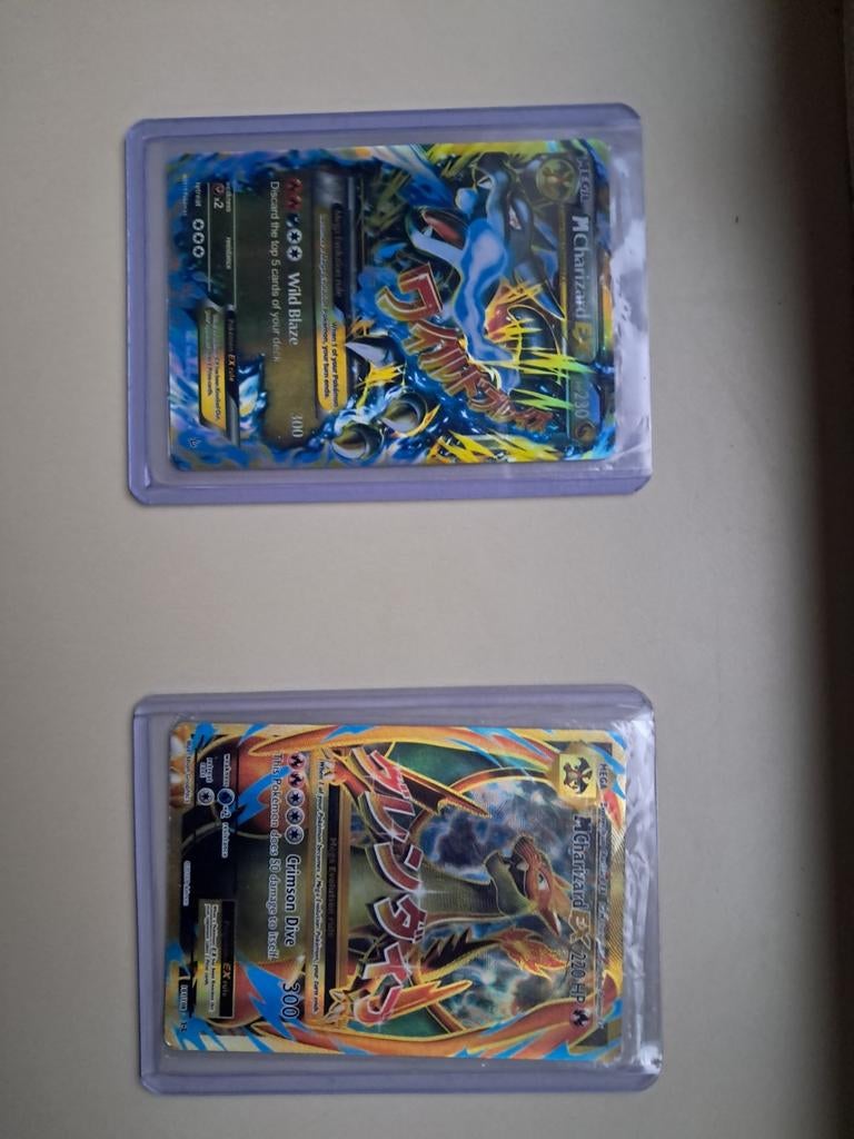2 Zeldzame Charizard Pokémon kaarten - Mega EX, Ophalen of Verzenden, Zo goed als nieuw, Meerdere kaarten, Foil